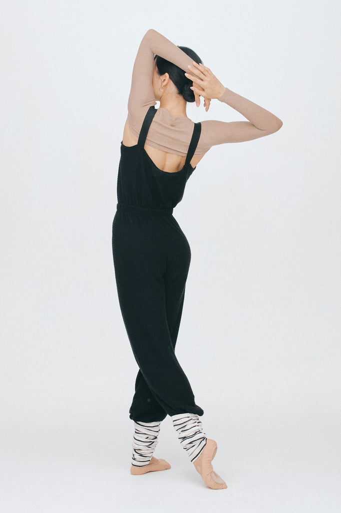 back view of the ecofriendly and black long romper from smk dancewear